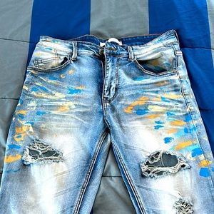 Ripped distressed painted jeans